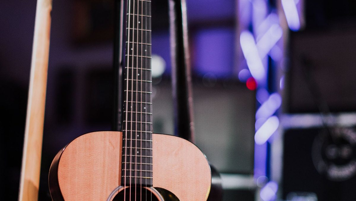 Acoustic guitar in concert lighting (illustrative music photography)